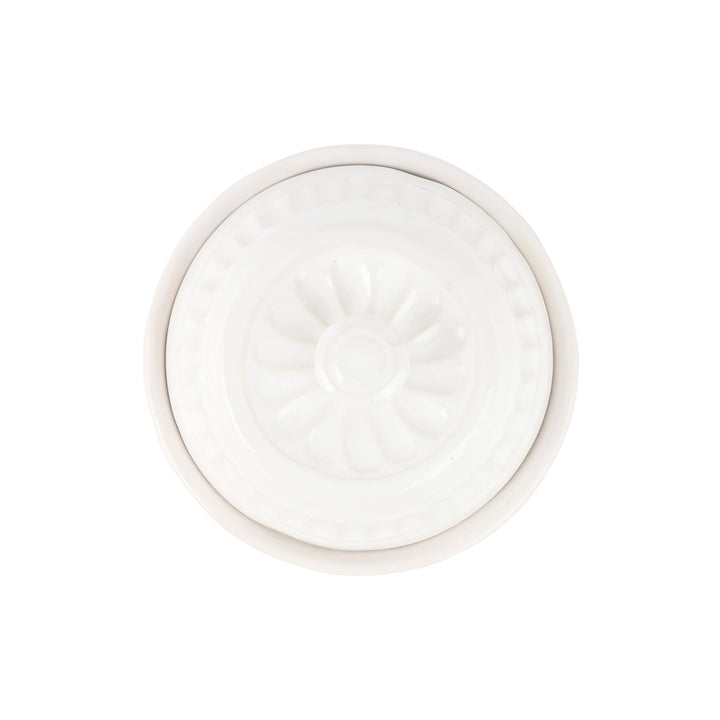 The top of a ceramic domed container 