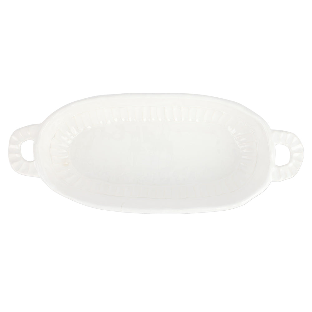 White ceramic baking dish with handles on a white background