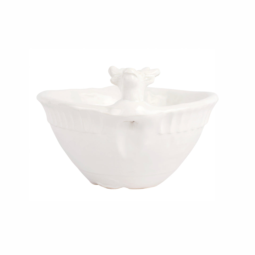 White ceramic bowl with reindeer design on a white background