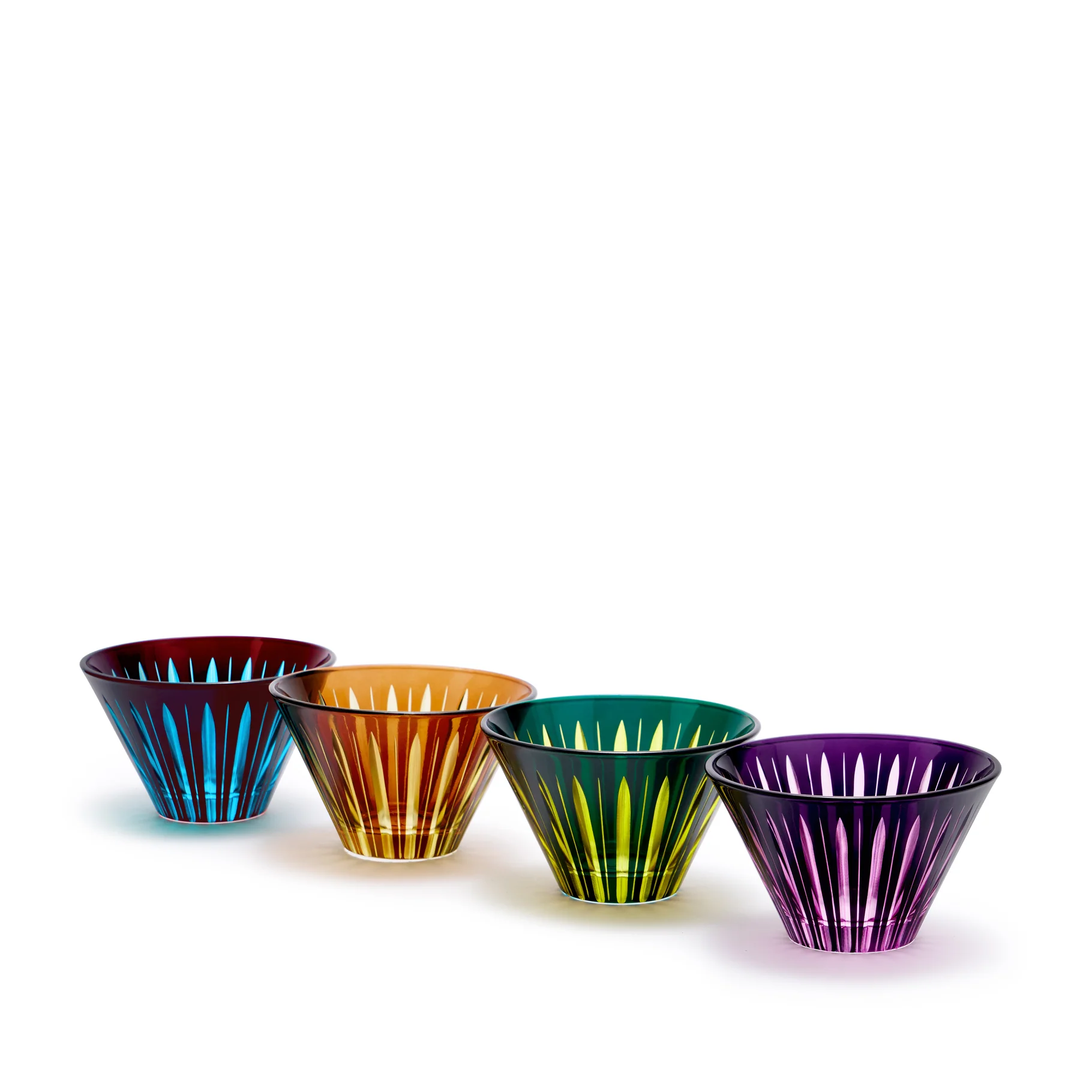 Four colorful glass condiment cups with striped patterns on a white background