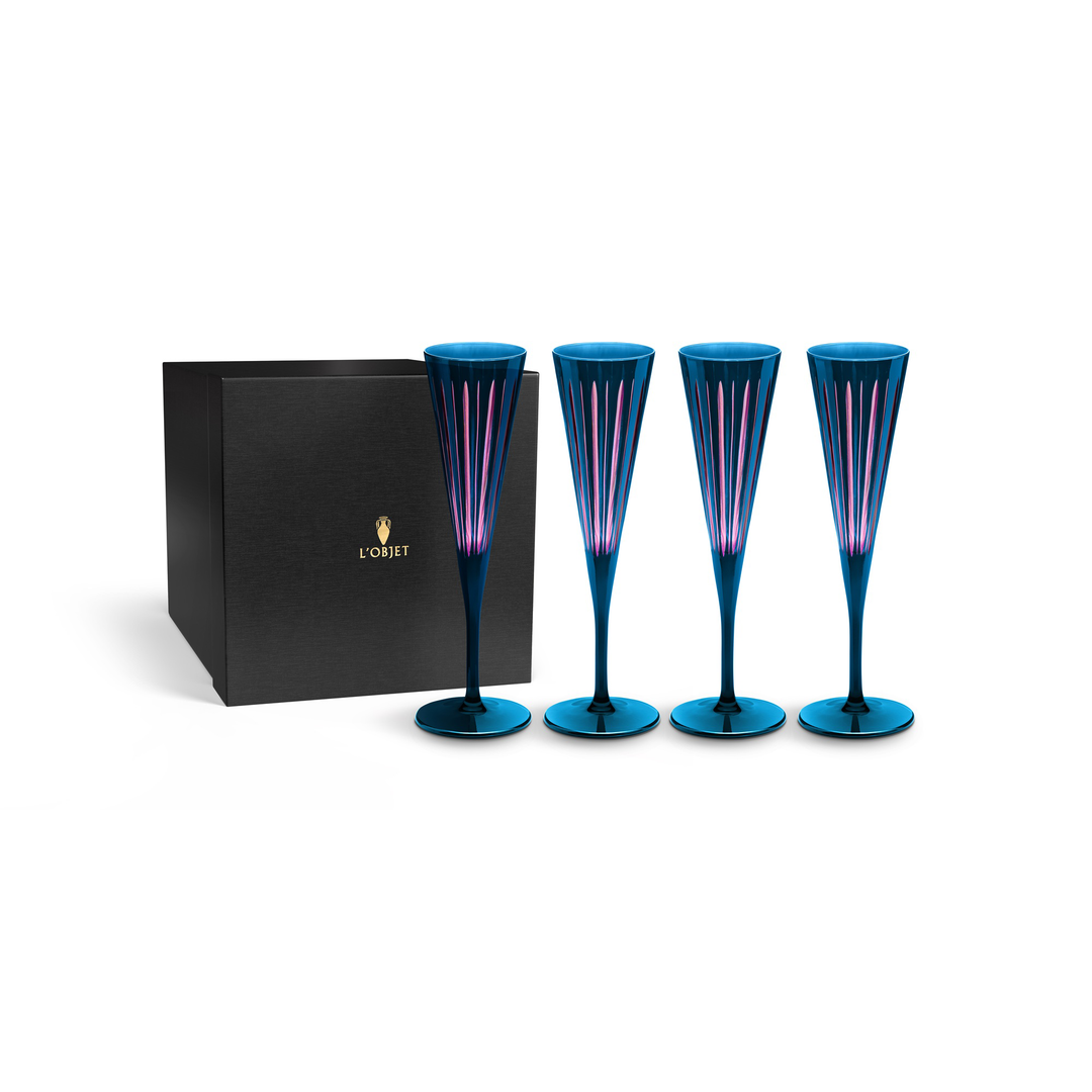 Set of four blue champagne flutes with a black gift box featuring a l'objet logo in gold foil