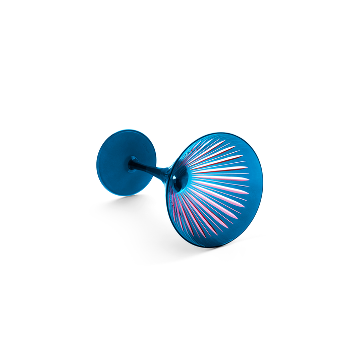 Blue martini glass cut to expose a pink interior