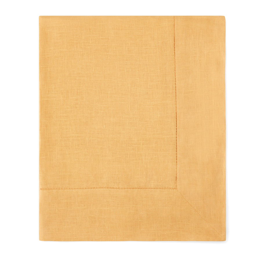 A folded mustard yellow linen napkin with a subtle woven texture and double-stitched border, displayed flat against a clean white background.