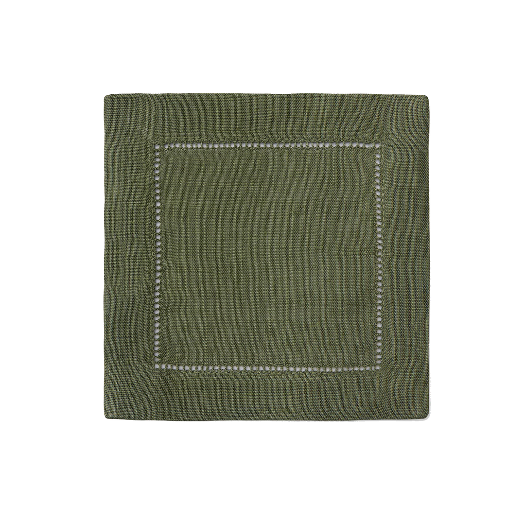 Green fabric napkin with white stitching on a white background