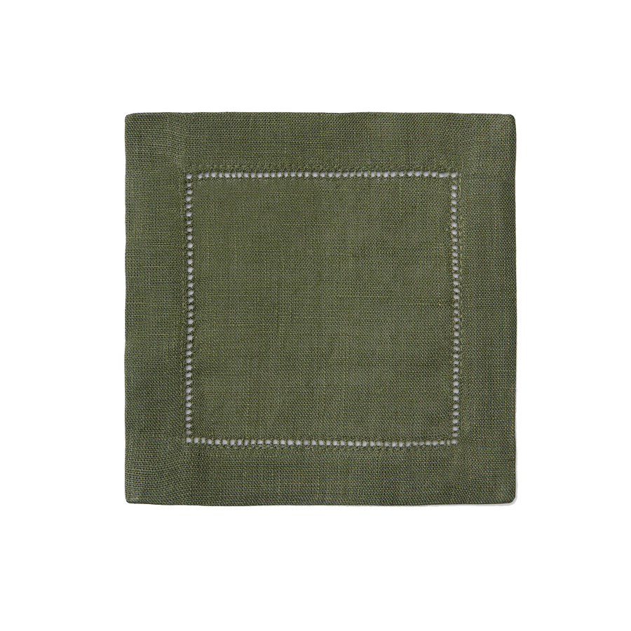 Green fabric napkin with white stitching on a white background