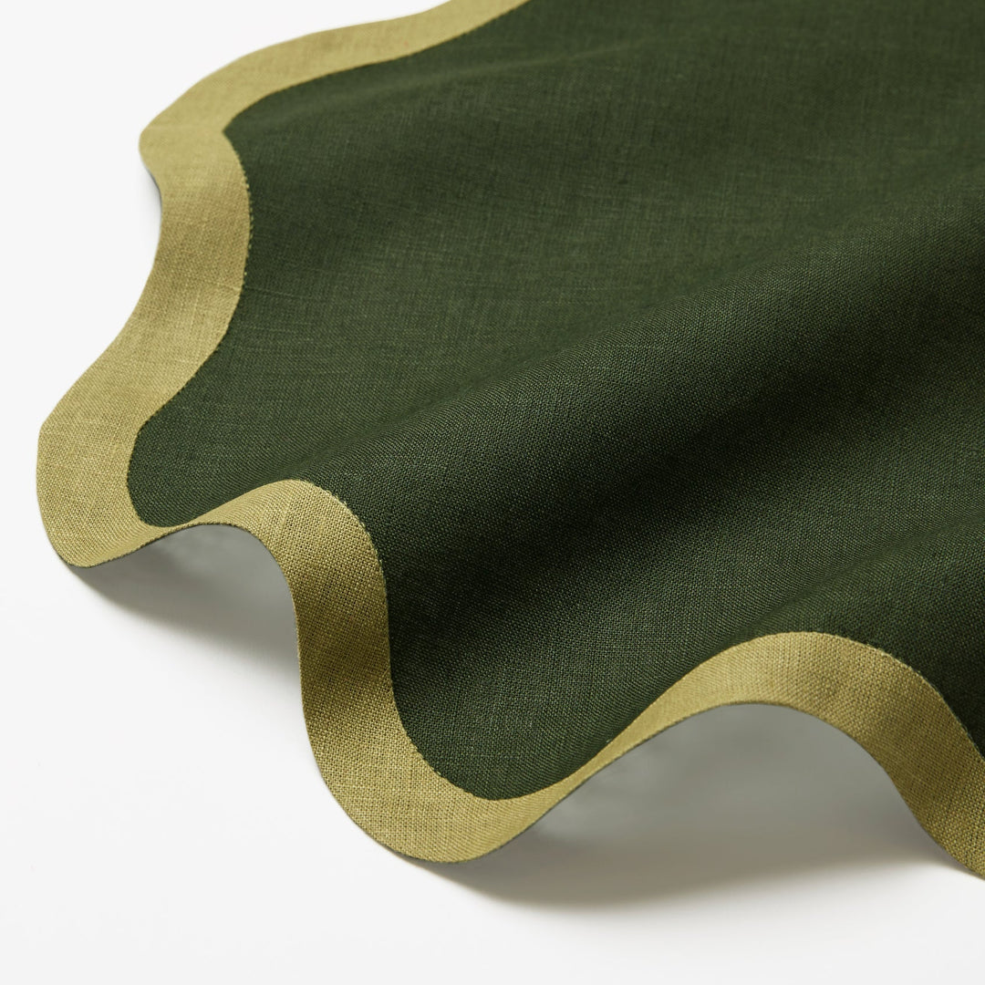 Green cocktail napkin with a wavy edge
