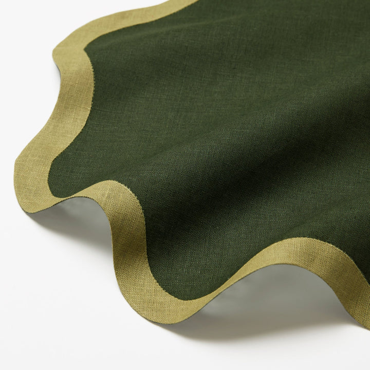 Green cocktail napkin with a wavy edge
