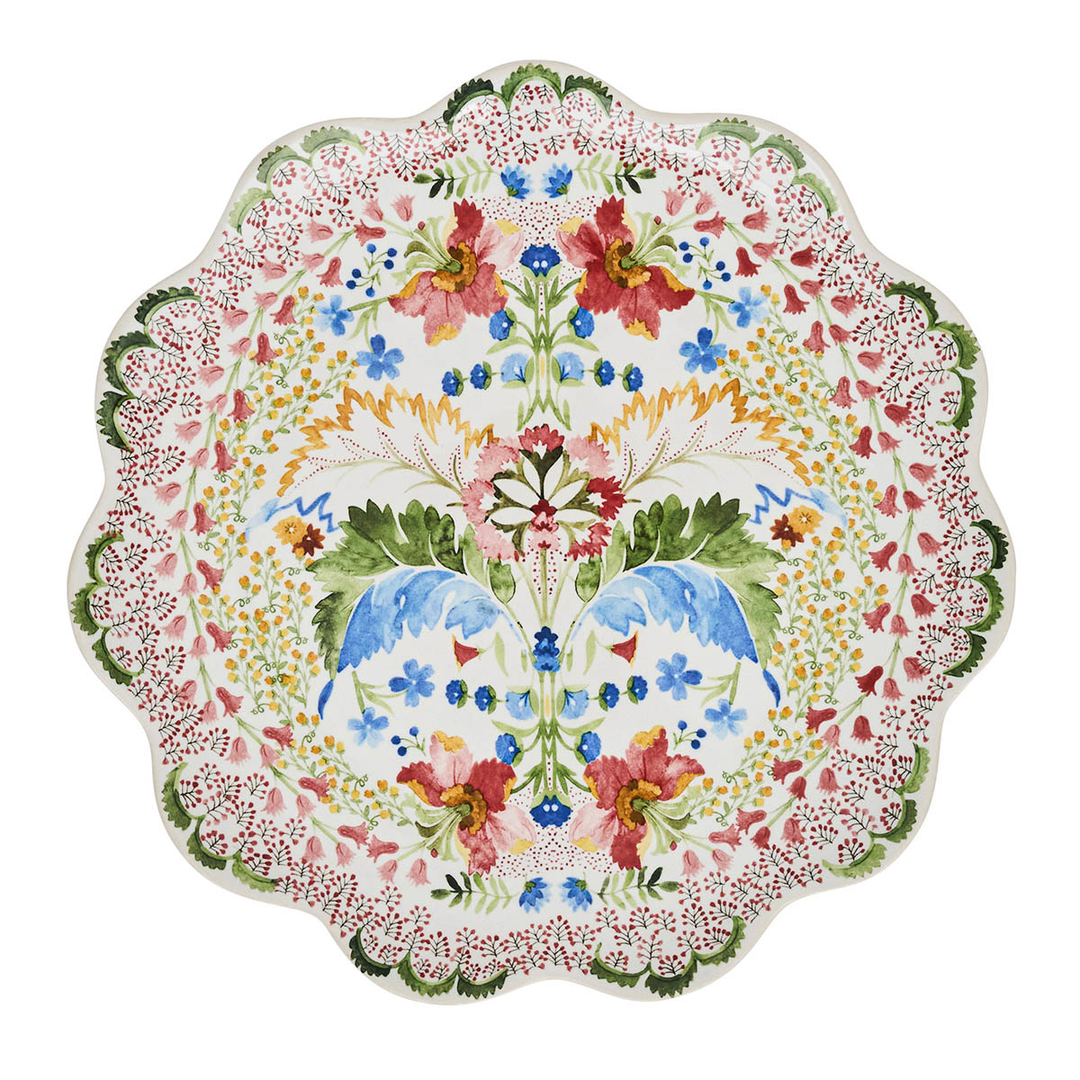 Decorative plate with a green pink and blue floral design