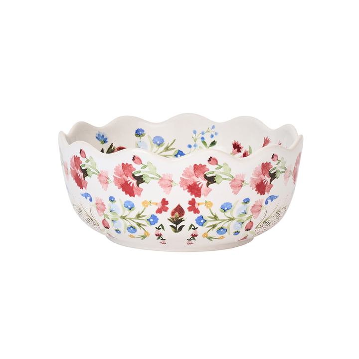 Decorative ceramic bowl with floral pattern and a wavy edge