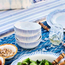 Load image into Gallery viewer, Juliska Sitio Stripe Delft Blue Cereal on a table with marbled puro wine glasses
