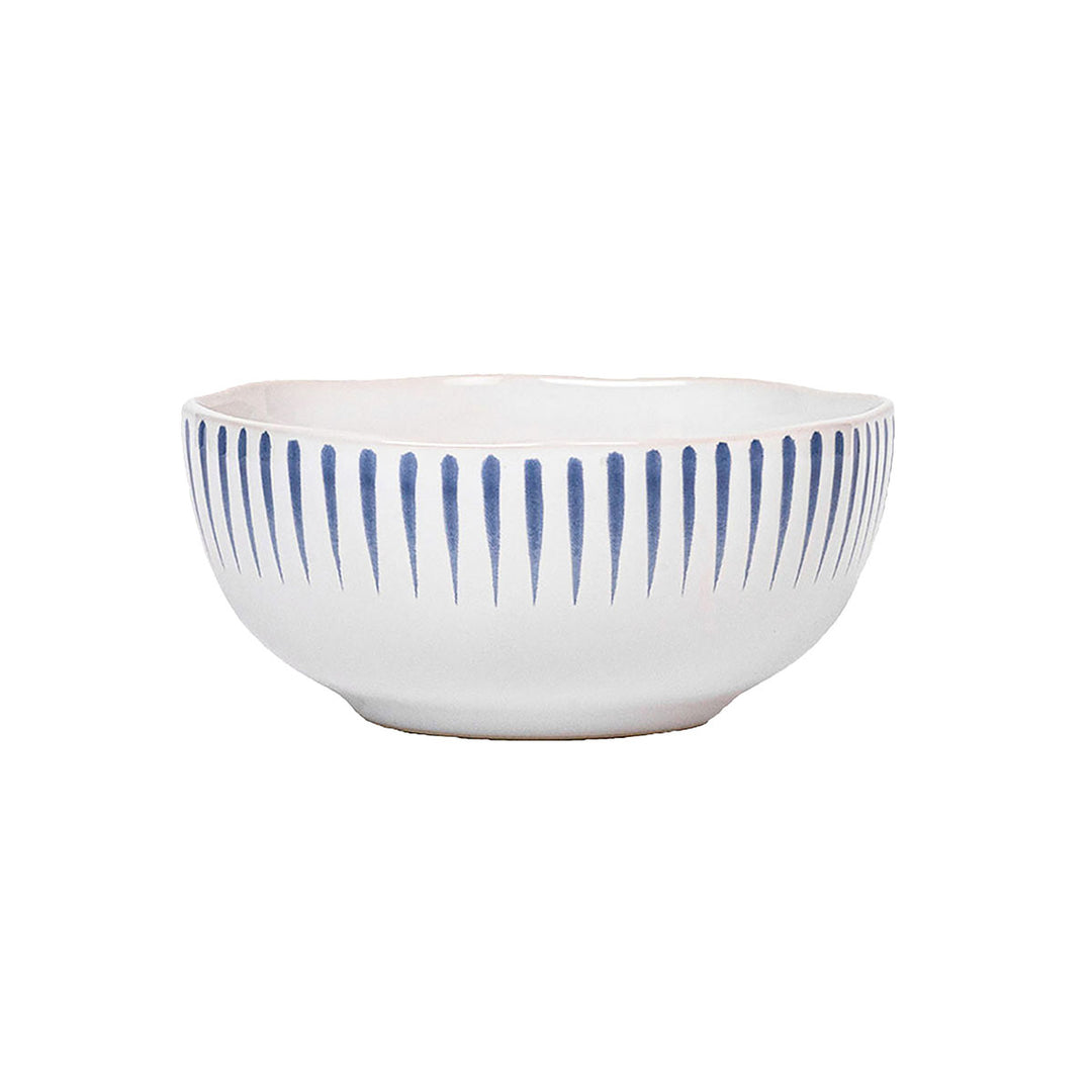 White bowl with short blue vertical strips along the rim