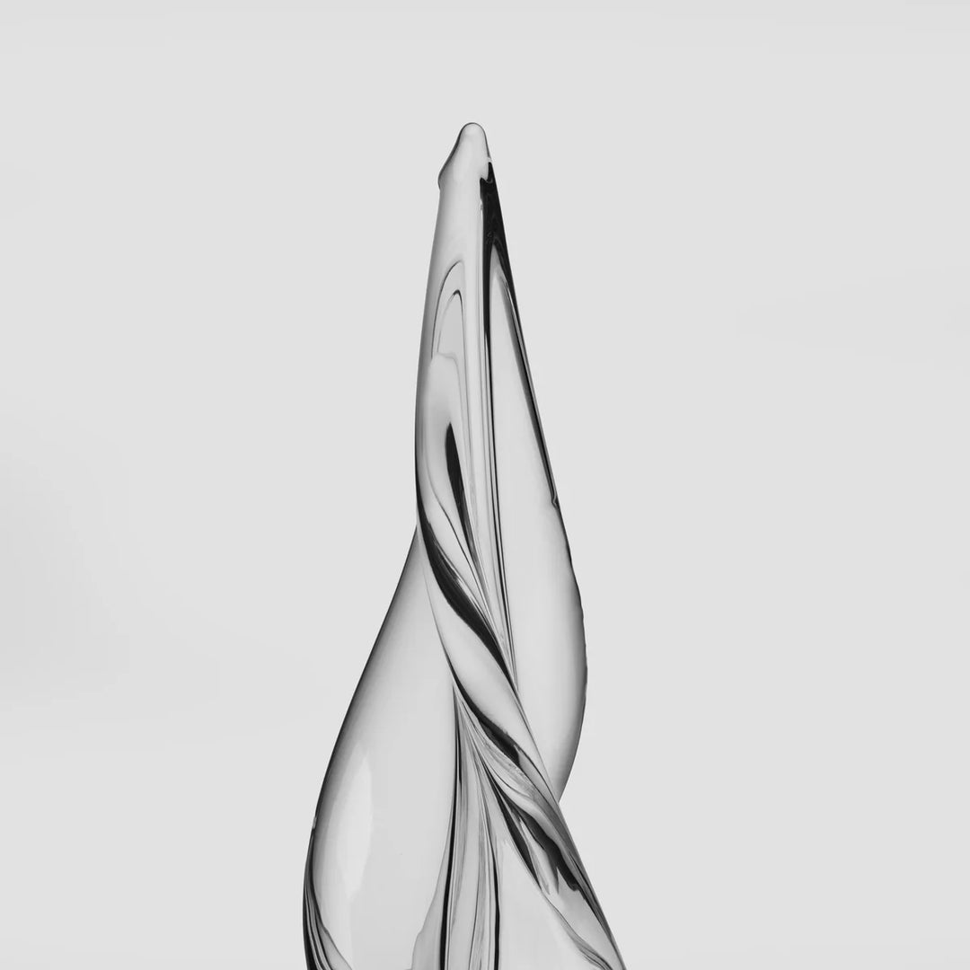 A close view of the top of a christmas tree twister glass sculpture 