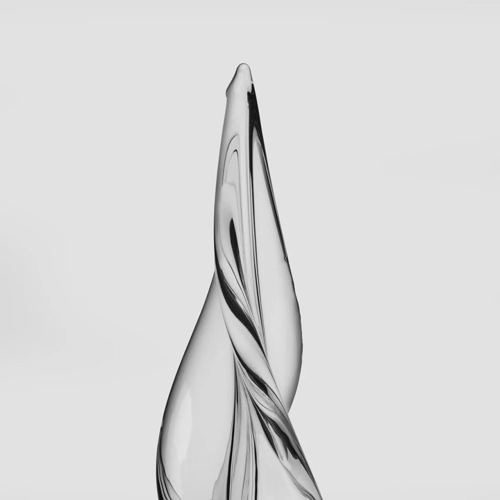 A close view of the top of a christmas tree twister glass sculpture 