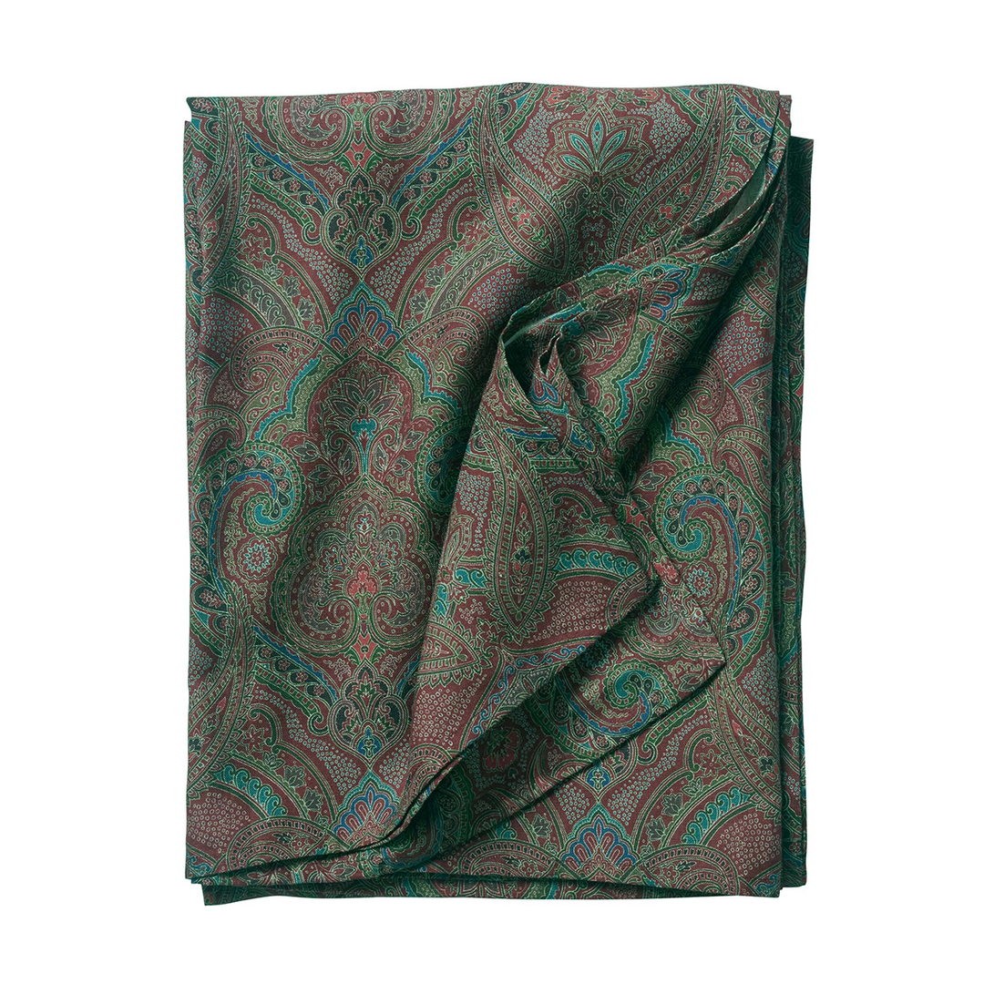 Folded fabric with a paisley pattern on a white background