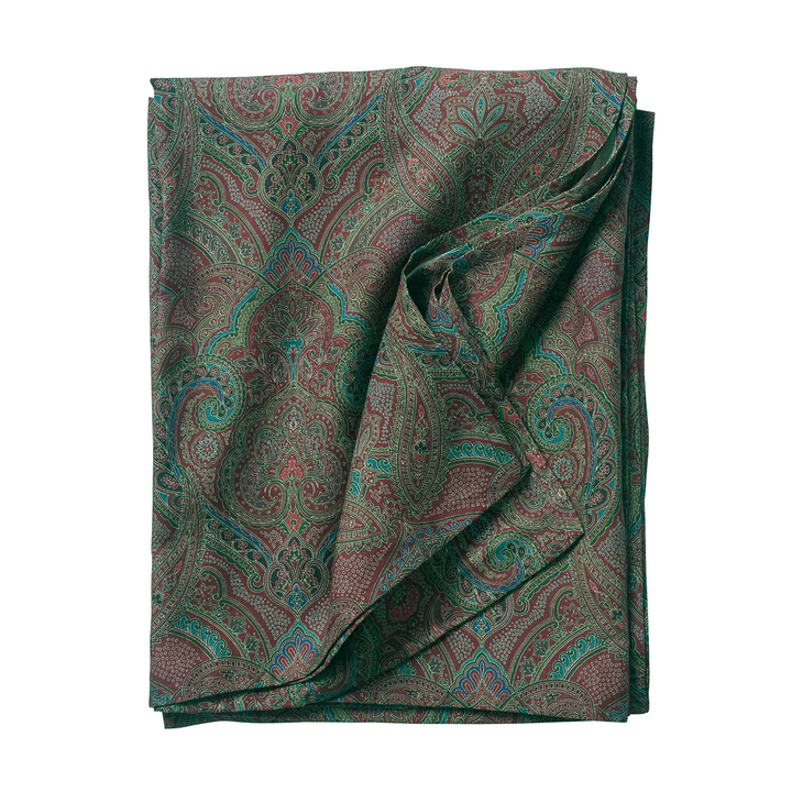 Folded fabric with a paisley pattern on a white background