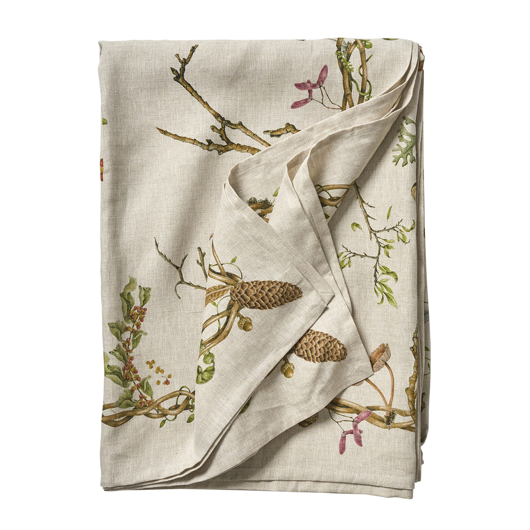 Folded fabric with nature-themed design on a white background