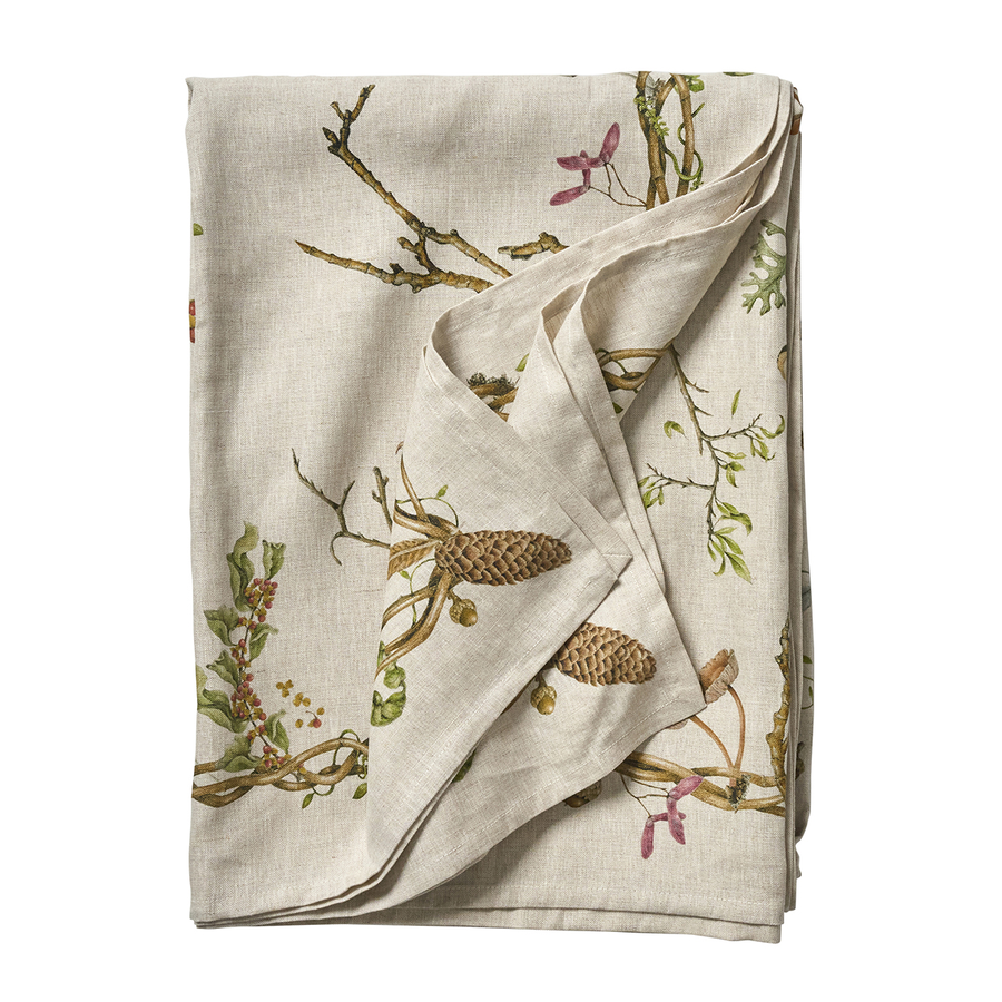 Folded fabric with nature-themed design on a white background