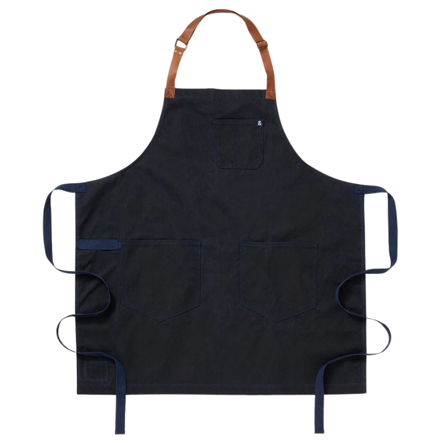 Navy blue apron with brown strap on a white background