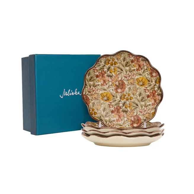 Decorative cocktail plates with fall floral design in front of a blue box with 'Juliska' branding.