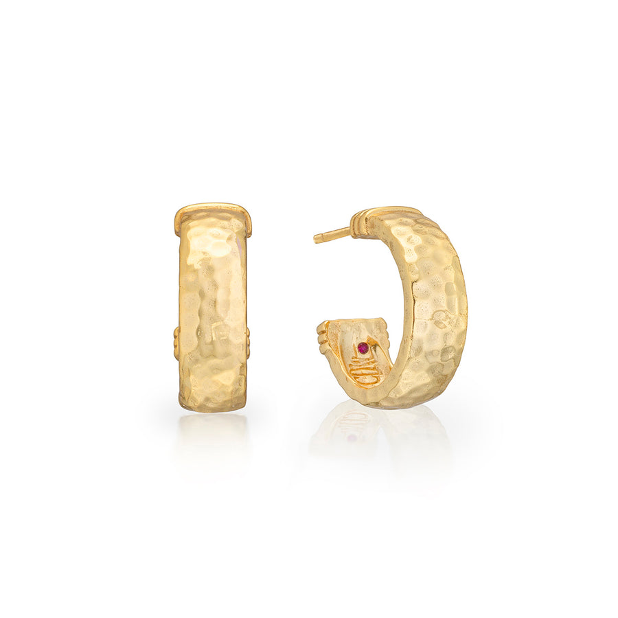 hammered gold hoop earrings with a small red gemstone