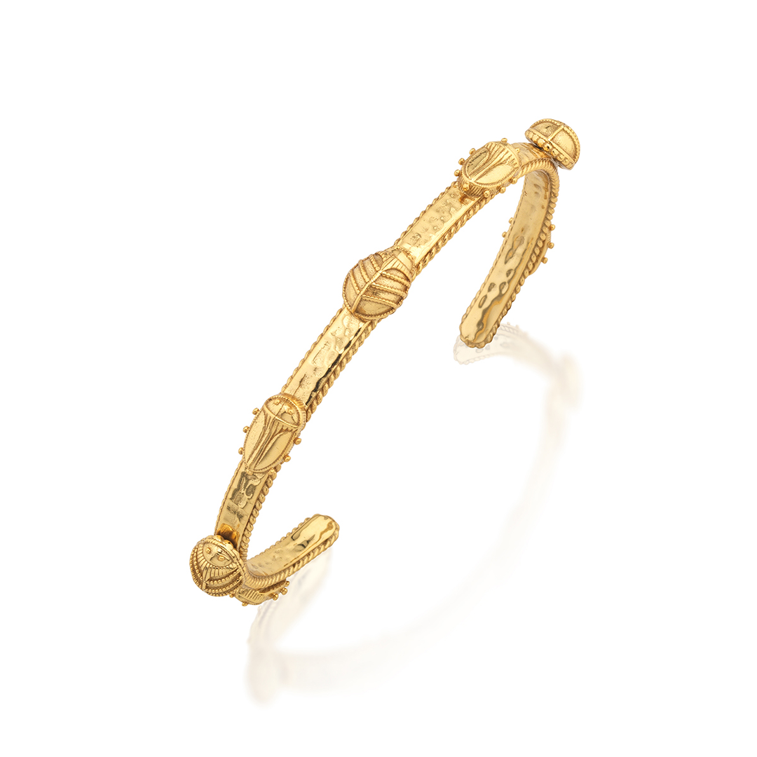 Gold bangle with intricate beetle design