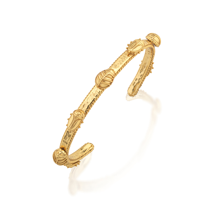 Gold bangle with intricate beetle design