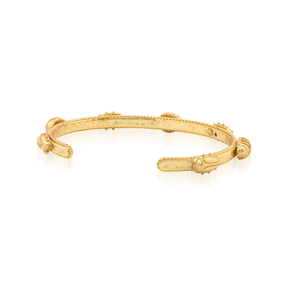 Gold bracelet with gold beetle designs