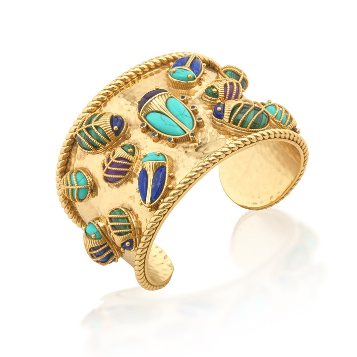 Gold bracelet with blue and green accents