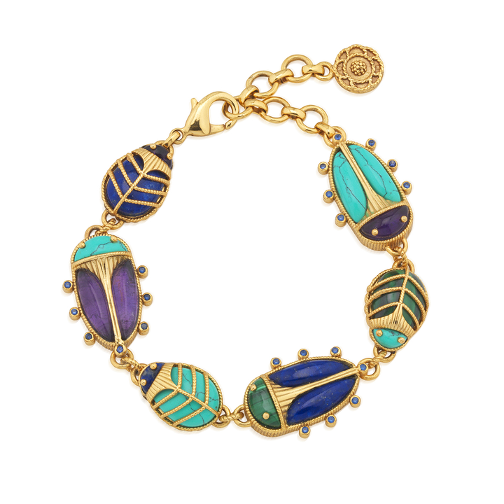 Gold bracelet with colorful beetle-shaped charms on a white background