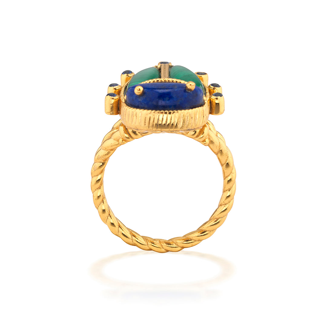 Gold beetle ring with a green and blue gemstone 