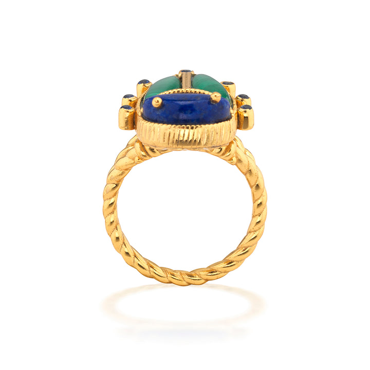 Gold beetle ring with a green and blue gemstone 