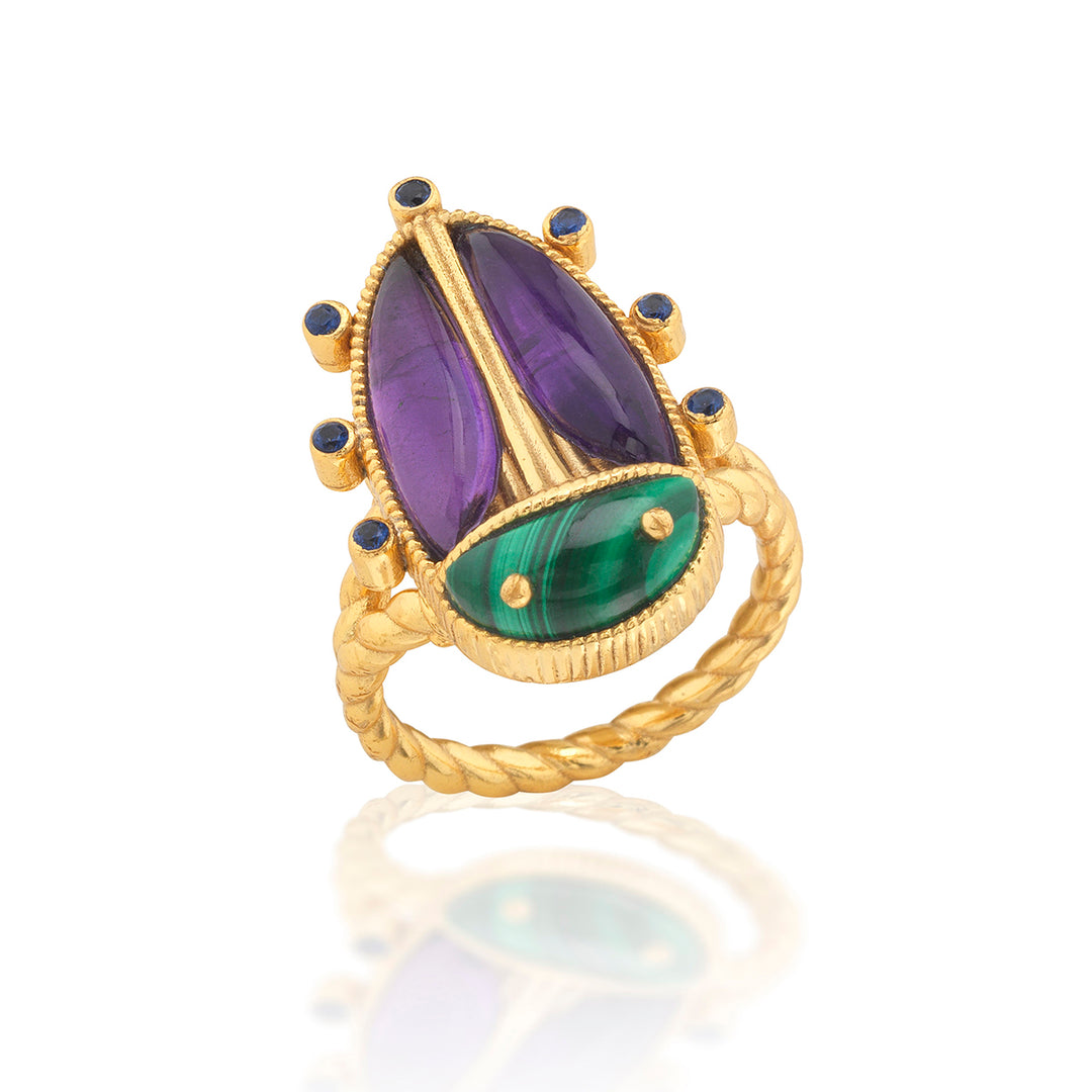 Gold beetle ring with purple and green gemstones 