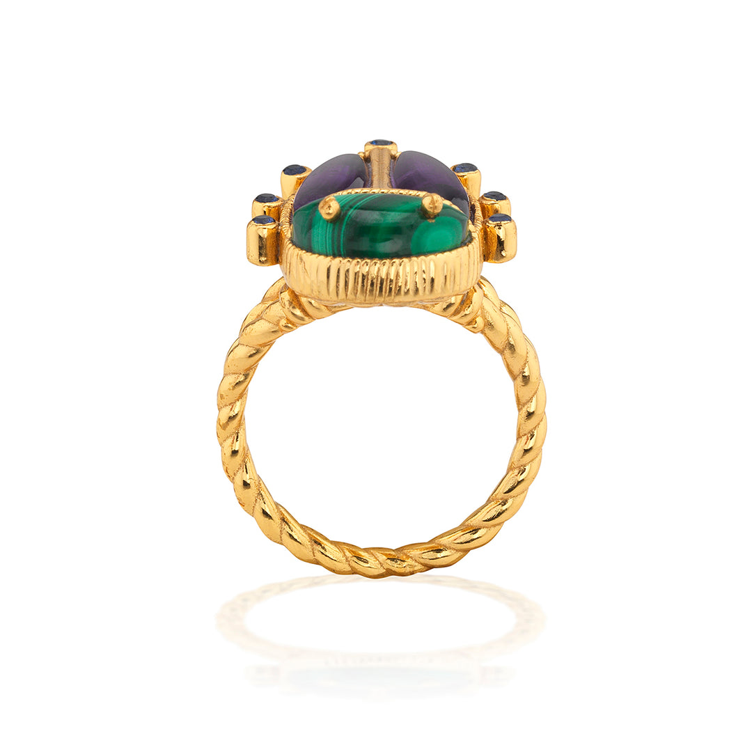 Gold beetle ring with a green gemstone