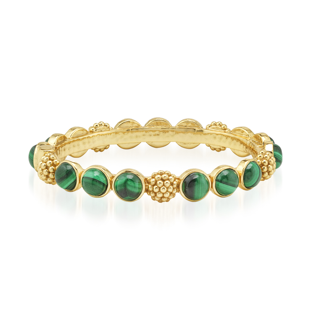 Gold bracelet with green gemstones