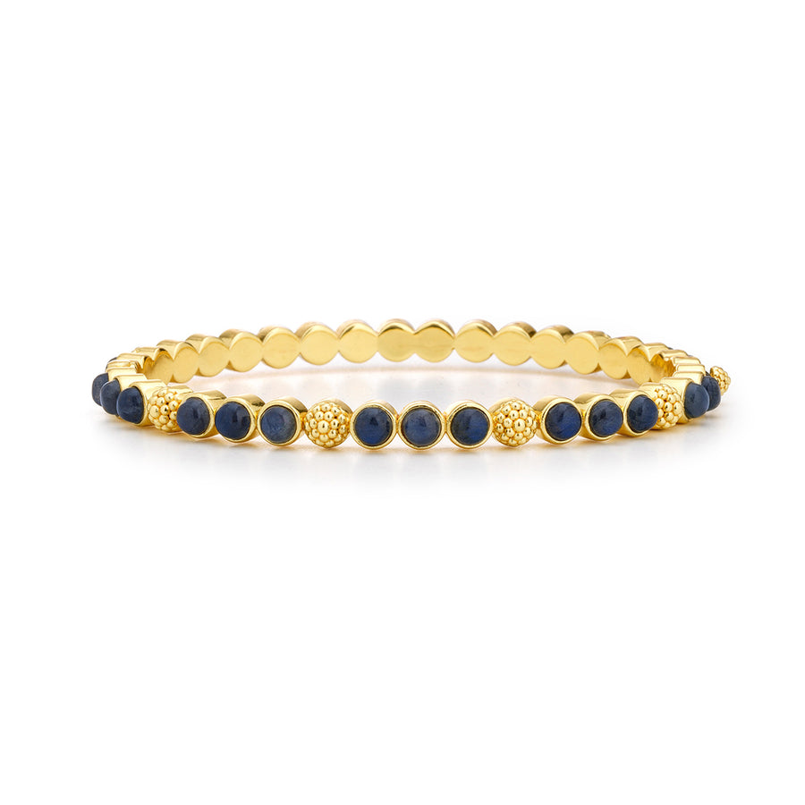 A gold and lapis lazuli bracelet with berry motifs
