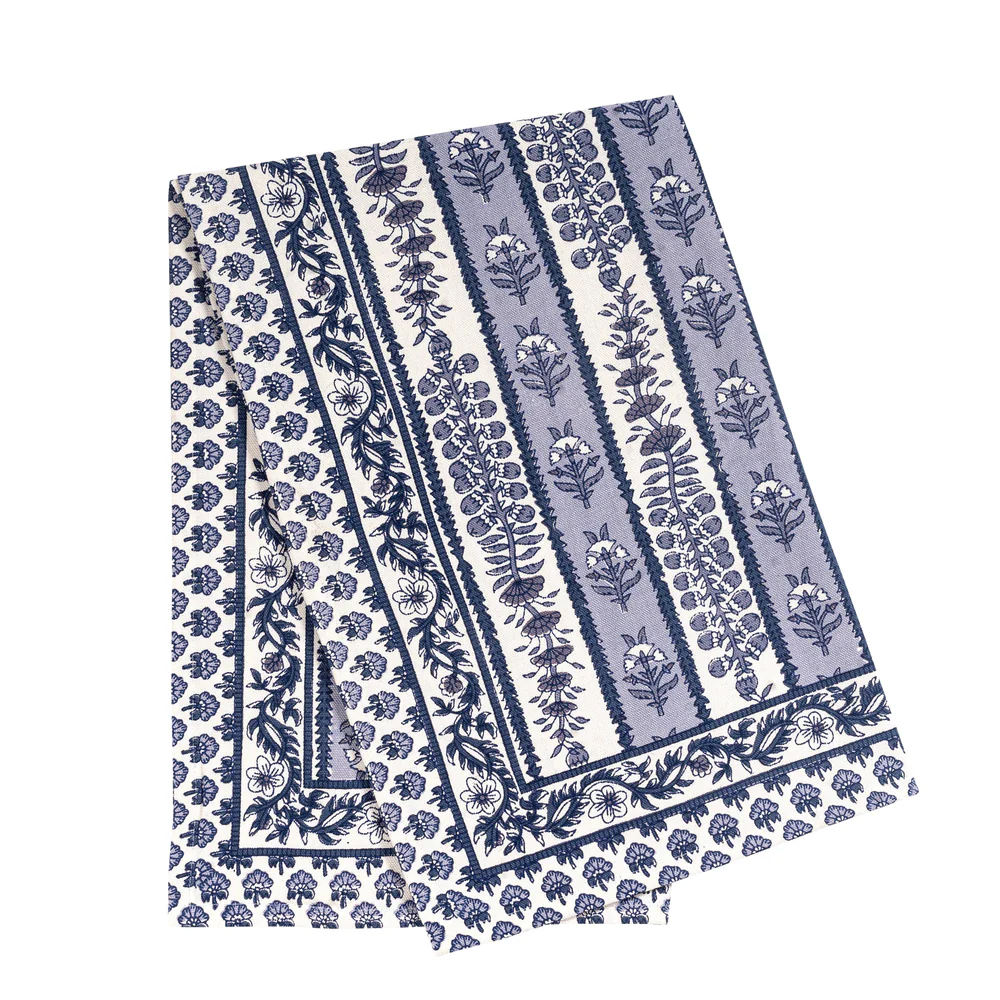Floral patterned tea towel with blue and white design on a white background