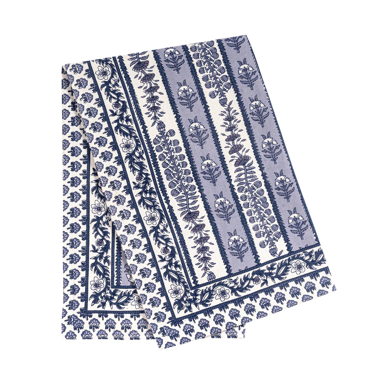 Floral patterned tea towel with blue and white design on a white background