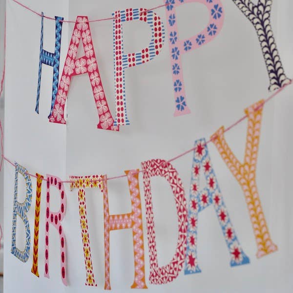 Colorful 'Happy Birthday' banner with patterned letters 