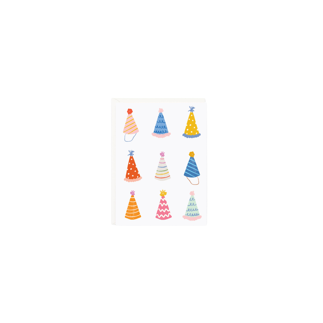 A gift enclosure card with an illustration of birthday party hats
