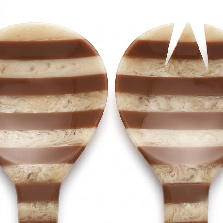 Two close-up views of a matching serving utensil set, likely spoons or a spoon and fork, with a glossy marbled pattern of dark brown and cream swirls on a white background.