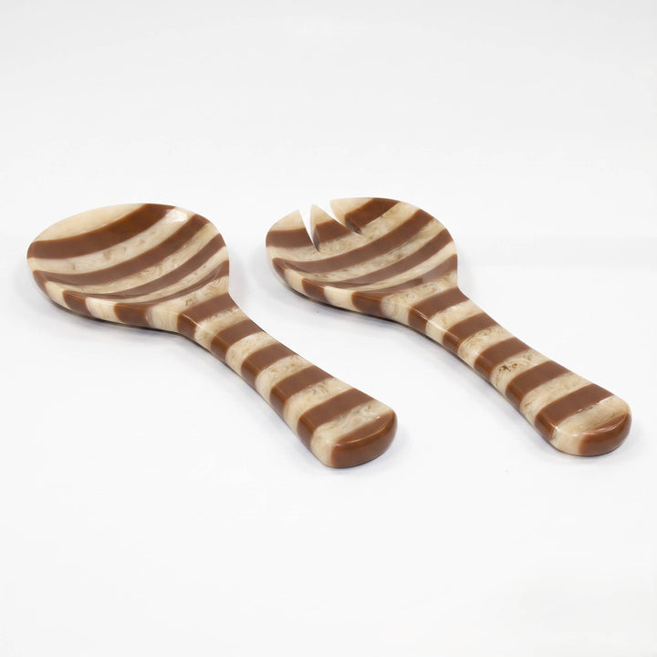 Two wooden salad spoons with a brown and beige marbled striped pattern, displayed on a clean white background.