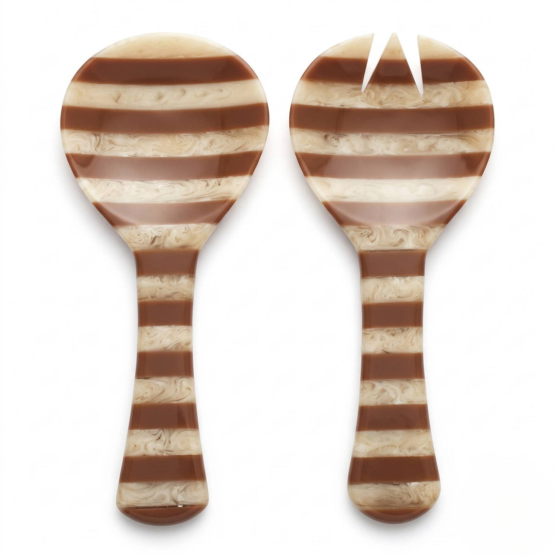 Two striped serving utensils, likely a spoon and a small fork, with alternating brown and cream marbled horizontal stripes, shown on a white background.