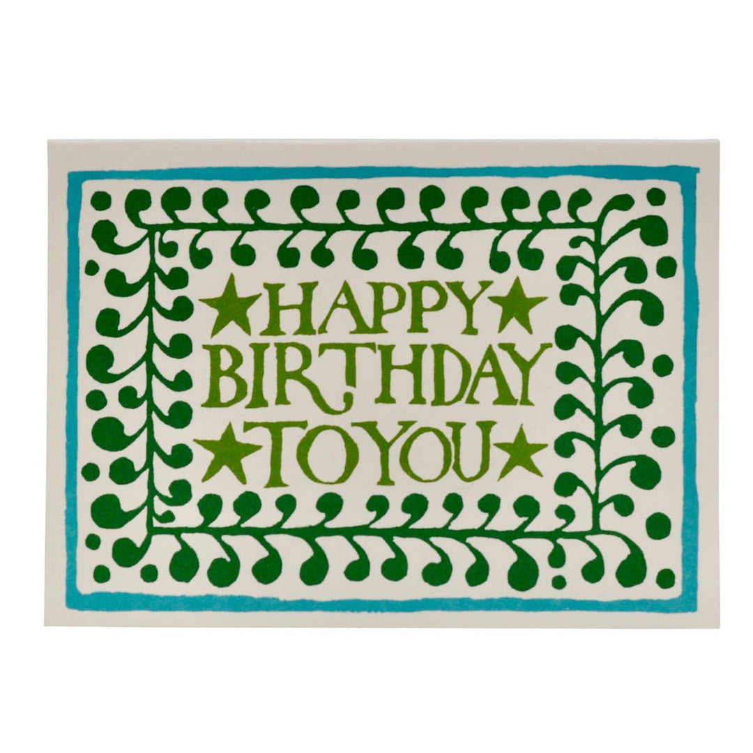 Card with 'Happy Birthday To You' text surrounded by green leaf patterns on a white background