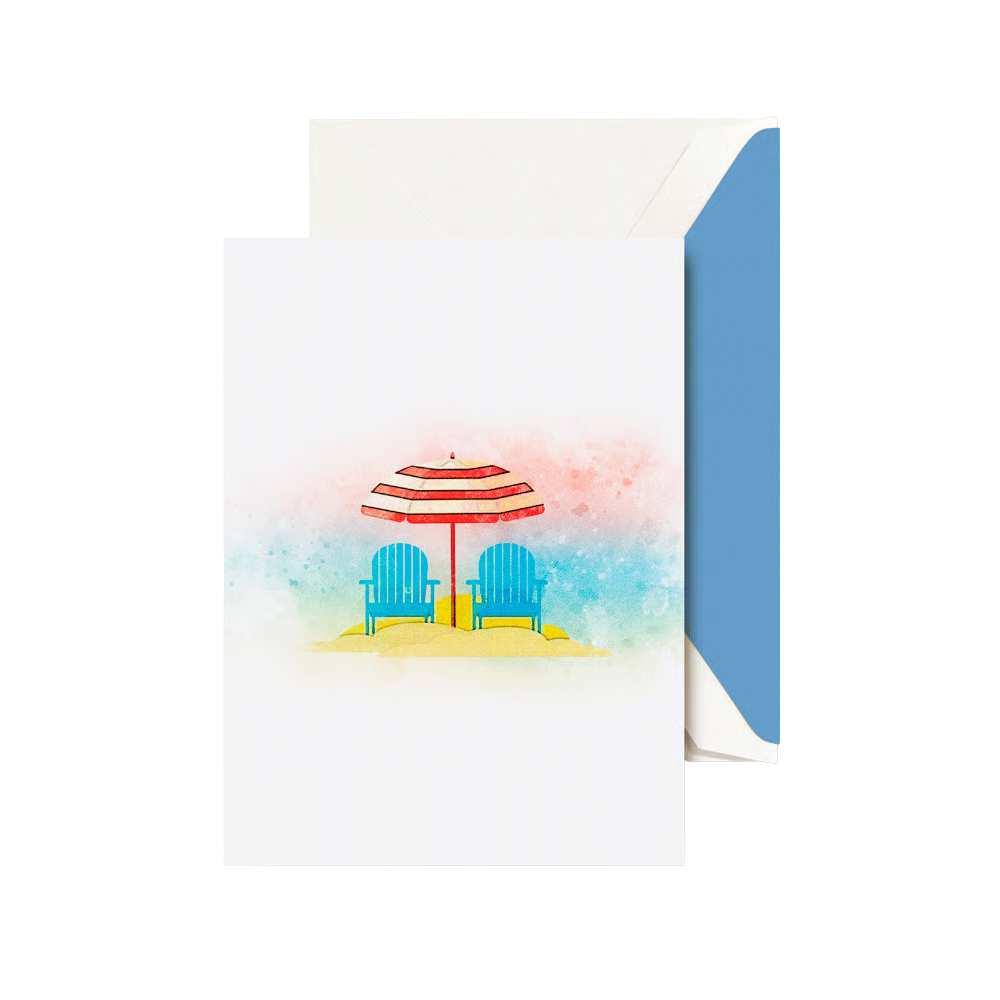 A folded card with a back scene of a red and white strped umbrella and two blue beach chairs. THe envelope has a blue liner