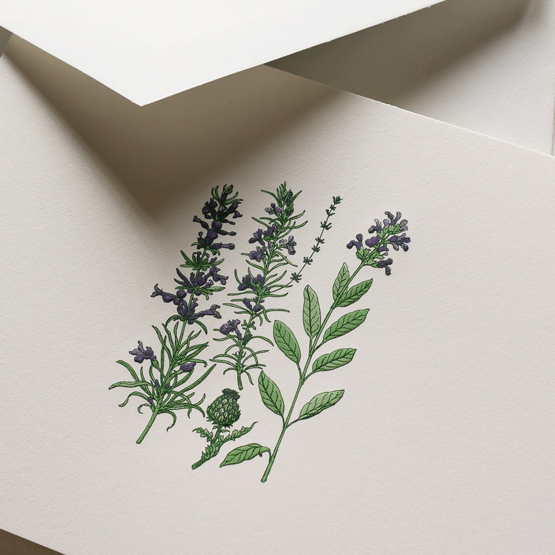 Floral design on a white card with a brown envelope