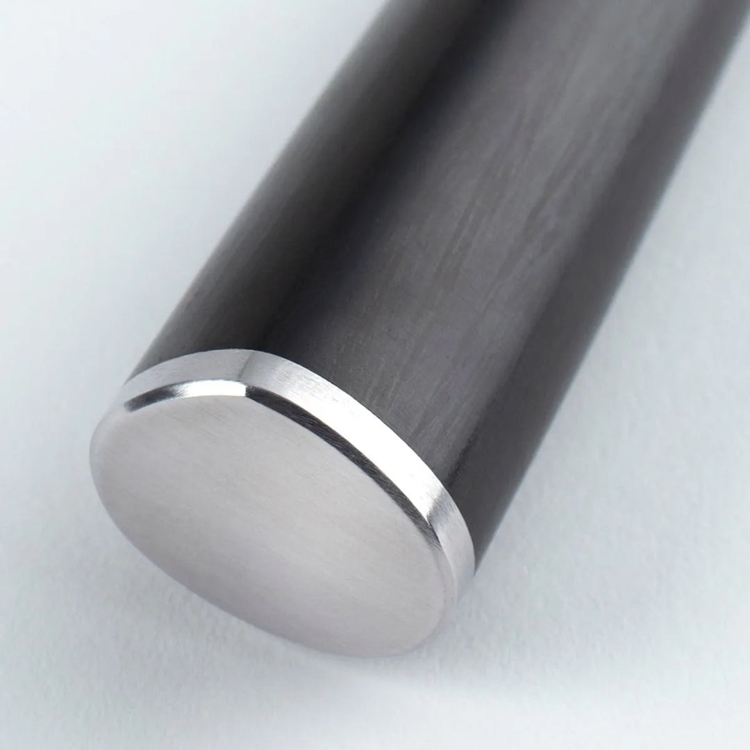 CLose up of a black knife handle with a metal pommel
