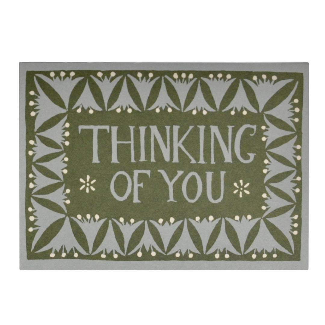 Decorative card with 'Thinking of You' text and green and pastel blue floral patterns