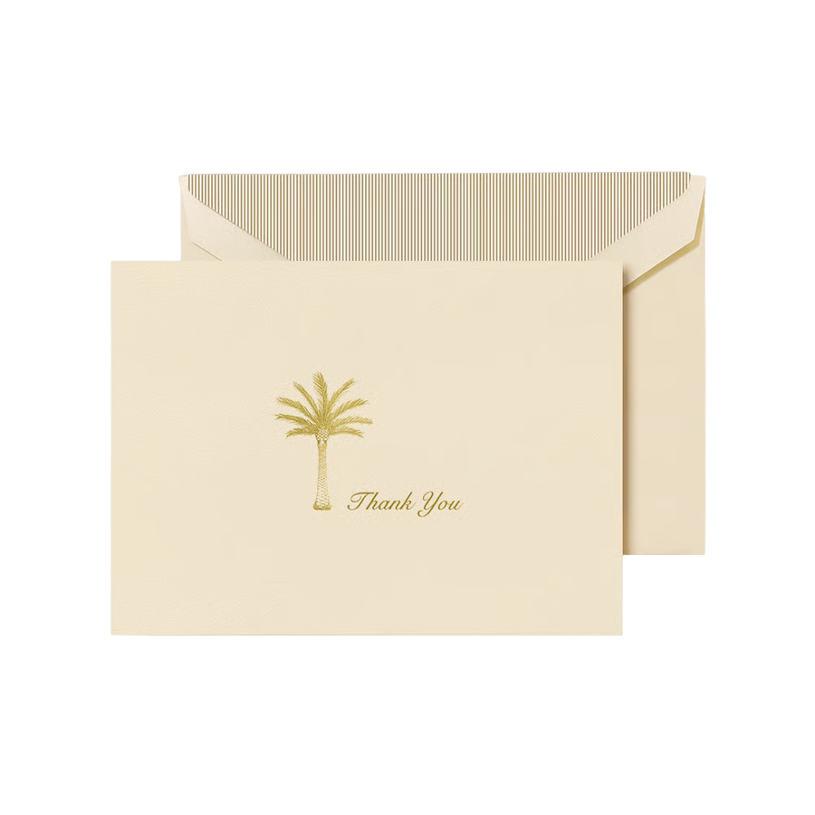 Ecru folded card with gold palm tree design and 'Thank You' text, paired with a matching envelope with a gold striped liner 
