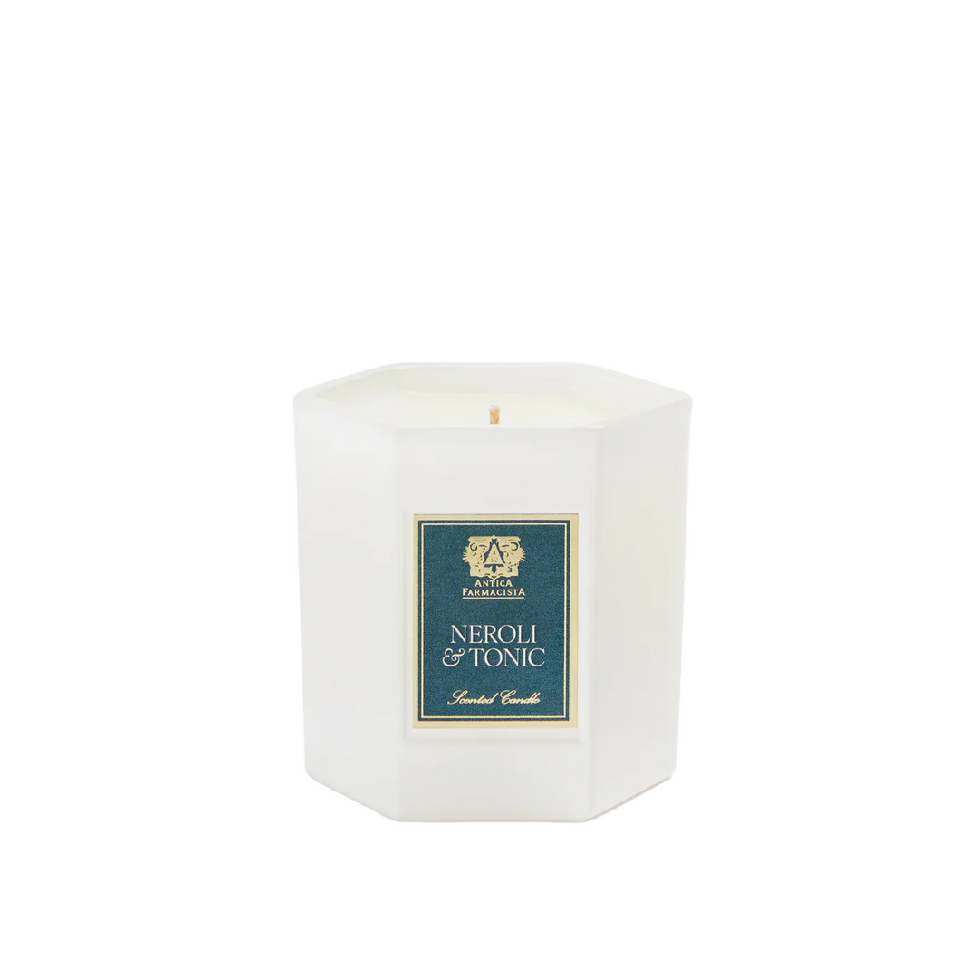 White candle with a blue label 
