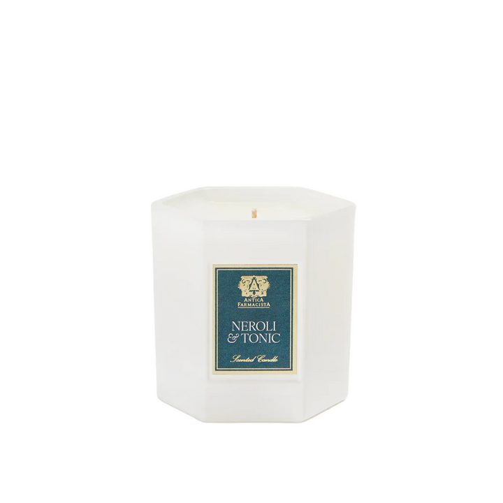 White candle with a blue label 